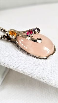 "This VINTAGE PENDANT is made with a Large PINK QUARTZ DROP enhanced with semi-precious prong set faceted stones set in Sterling Silver ( 925 ) I think the piece is Handcrafted but I could be wrong---you decide. The heavy chain is marked 925 on the clasp & is 22\" long ( for all sizes see photos ) This pendant is VERY GOOD-EXCELLENT VINTAGE CONDITION . Questions ? Please call 1-207-865-6191." Elegant Pink Multi-stone Necklace, Pink Gemstones In Fine Jewelry Style, Pink Multi-stone Gemstones For Gift, Elegant Pink Gemstones With Accents, Fine Jewelry Pink Multi-stone Necklace, Pink Gemstones With Accent Stones For Gift, Pink Gemstones In Sterling Silver Fine Jewelry, Silver Multi-stone Briolette Gemstones, Fine Jewelry Pink Stone Setting Jewelry