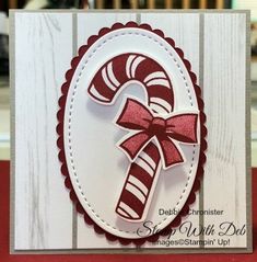 a close up of a card with a candy cane