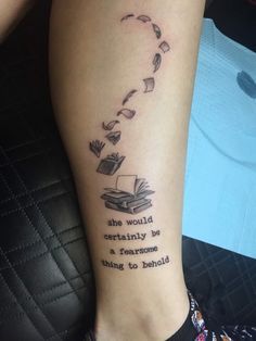 a woman with a book tattoo on her leg that reads she would certainly be a tearsome thing to behold