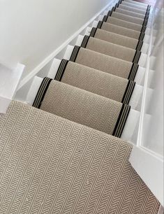 Fibre flatweave herringbone carpet in colour chalk with a tape edged stair runner in black and cream stripe Cream Runner Stairs, Stair Runner Hallway, Stairs With Runner And Rods, Staircase Ideas Carpeted Runner, Herringbone Sisal Stair Runner, Stair Runner Carpet Top Of Stairs, Herringbone Runner Stairs, Black And Cream Hallway, Cream And Black Hallway