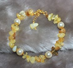 "*Meet the miracles of natural stones without sacrificing your elegance. I make it every day, so shipping will be quick bracelet is prepared carefully and with love. Meterial is special Citrine stone present *The product has an adjustable chain. You can adjust it to your wrist. *I send it with gift card and the name section on the card will be empty. You can write the name of the person you want to give it as a gift. -Features Of Citrine: Citrine is such a strong gemstone for manifestation of mo Amber Crystal Bracelet With 8mm Beads As Gift, Amber Crystal Bracelet With Gemstone Beads As Gift, Amber Gemstone Beads Crystal Bracelet As Gift, Spiritual Amber Crystal Bracelet With Gemstone, Spiritual Amber Crystal Gemstone Bracelet, Elegant Adjustable Citrine Crystal Bracelet, Amber Gemstone Beads Spiritual Crystal Bracelet, Hand-strung Amber Crystal Bracelet For Healing, Mineral Crystal Bracelet With Stones As Gift