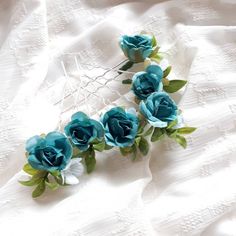 This teal flower hair pins wedding , of artificial flowers of purple and leaves.  This a beautiful and delicate hair accessory for brides and a nice gift to the bridesmaids   On the wedding day, every bride wants to look fantastic. This bridal floral hair pins, will be a magical addition to your look on your happiest day.  This will emphasize the ease of your image.  The comb is very conveniently attached to the hair and fits in with any hairstyle.  -Material- artificial flowers and artificial greenery  -Colors- teal, green - Unique handmade.  Wedding - is one of the most important events in the life of any girl I am happy to try to make the most beautiful decoration for you, to make you feel the most beautiful bride Bridal Floral Hair, Flower Hair Pins Wedding, Teal Bridesmaid, Flower Bridal Hair, Hair Pins Wedding, Purple Accessories, Floral Hair Pins, Flower Hair Pins, Teal Hair