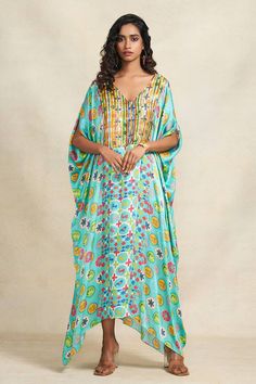 Turquoise kaftan featuring animal, abstract floral and geometric prints along with sequin embroidered bodice. - Aza Fashions Bollywood Style Sequined V-neck Dress, Bollywood V-neck Sequin Dress, Bollywood Style Embellished V-neck Kaftan, Festive Printed V-neck Kaftan, Summer Festive V-neck Kaftan, Bollywood Sequin V-neck Dress, Festive V-neck Kaftan For Festival, Multicolor Printed V-neck Kaftan, Multicolor V-neck Kaftan With Printed Motifs