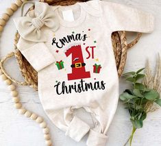 Personalized Baby Romper: Celebrate Your Baby's First Christmas in Style Celebrate your baby's first Christmas in style with our Personalized Christmas Neutral Baby Romper. This soft and comfortable outfit, available with a bow or hat, features charming motifs like "My 1st Christmas" and can be personalized with your baby's name. Perfect for capturing precious newborn pictures, it also makes an adorable coming-home outfit or a thoughtful baby shower gift. With footies for extra warmth, this romp Christmas Baby Outfits, Christmas Onsies, Christmas Neutral, Christmas Baby Romper, My 1st Christmas, Xmas Outfit, Thoughtful Baby Shower Gifts, Outfit Christmas, Comfortable Outfit