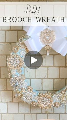 a diy brooch wreath on a brick wall