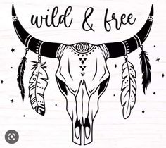 an animal skull with feathers on it and the words wild and free written in black ink