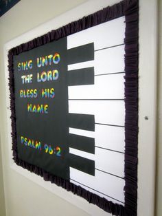 a bulletin board with the words sing unto to the lord and his name written on it