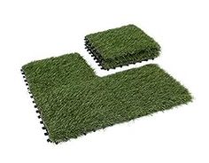 two pieces of artificial grass sitting on top of each other