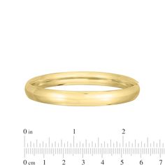 Complement any attire with the simple and sleek design of this polished bangle bracelet in 14K gold. Fashioned in 14K gold This classic bangle shines with a polished 8.0mm tube. This bracelet measures 7.0 inches in circumference and secures with a hinged clasp. Formal Bangle With Shiny Finish, Minimalist Polished Bangle For Formal Occasions, Classic Oval Bangle For Wedding, Classic Yellow Gold Bangle For Formal Occasions, Classic Oval Wedding Bangle, Classic Gold Bangle With Shiny Finish, Classic Oval Gold Bracelet With Polished Finish, Classic Oval Bangle For Anniversary, Classic Oval Bangle For Formal Occasions