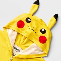 Your child will love bringing fun style to their sleepwear with this Pokémon Sleep Romper. This short-sleeve sleep romper is crafted from lightweight fabric for all-night comfort and features a front full-length zipper for easy on and off. Designed in a yellow hue, it features Pikachu face graphic on the attached hood for fun style. Playful Cartoon Print Onesie For Sleepovers, Playful Hooded Onesie For Sleepovers, Playful Cartoon Print Onesie For Sleep, Cute Yellow Onesie For Loungewear, Playful Yellow Onesie For Loungewear, Fun Short Sleeve Onesie For Playtime, Playful Short Sleeve Onesie, Playful Short Sleeve Onesie For Bedtime, Playful Yellow Short Sleeve Onesie