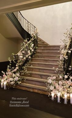 the stairs are decorated with flowers and candles