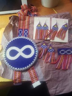 several pieces of beaded jewelry are displayed on a table