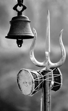 an old fashioned metal bell with two large horns attached to it