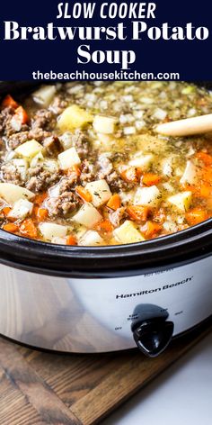 a slow cooker filled with meat and potatoes