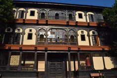 an old building with lots of windows and balconies