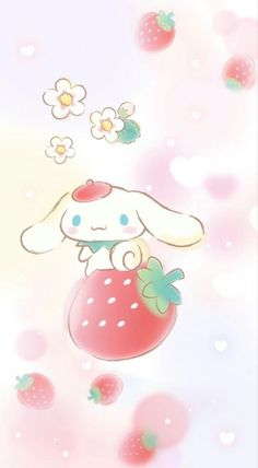 a cute little bunny sitting on top of a strawberry