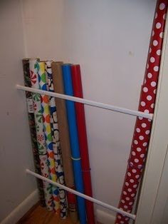 several rolls of wrapping paper sitting on top of each other in front of a door