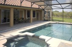 an outdoor swimming pool in the middle of a house