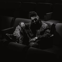 a man sitting in an empty theater seat