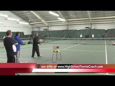 some people are on a tennis court with racquets and ball rackets