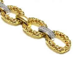 Krypell Gold Diamond Heavy Wide Link Bracelet This Charles Krypell bracelet showcases an elegant composition of ornate 18K yellow gold, crafted with precision to form a series of sumptuous links that catch the light with every movement. This piece is a striking example of craftsmanship and luxury, perfect for enhancing any ensemble with a rich, opulent touch. Whether worn as a statement piece or paired with other fine jewelry, it promises to be a captivating addition to any collection. Bracelet Luxury Diamond Chain Bracelet With Rectangular Links, Luxury Ornate Collectible Bracelets, Luxury Statement Yellow Gold Diamond Bracelet, Luxury Chain Link Bracelets With Box Clasp, Luxury Yellow Gold Ornate Bracelets, Luxury Statement Diamond Bracelet In Yellow Gold, Luxury Yellow Gold Ornate Bracelet, Luxury Antique Yellow Gold Chain Bracelet, Luxury Hallmarked Vintage Chain Bracelet