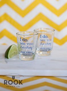 two shot glasses sitting on top of a table