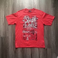 Vintage 2000s SouthPole Graphic T-Shirt - Size XXL (Length 31", Chest 23") - No holes no stains - Message for more information Please take note of the measurements listed as these are vintage clothes and may fit different than the tag size. Follow our page for more vintage clothing drops! DISCLAIMER: All items are vintage so please be mindful that if by chance there is a flaw on the item we simply may have just missed it. Inquire for more product information. 90s Red T-shirt With Text Print, Red Oversized 90s Tops, Oversized 90s Red Top, Red Y2k Cotton T-shirt, Red Y2k Style Cotton T-shirt, Oversized Red Hip Hop Top, Red Y2k T-shirt For Streetwear, Red Relaxed Fit Hip Hop T-shirt, Oversized Urban Red Top