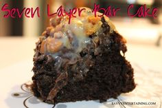 a close up of a piece of cake on a plate with the words seven layer bar cake