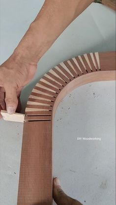 a person is working on a piece of wood