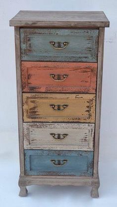 a multicolored dresser with five drawers