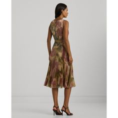 Crafted with foiled chiffon for a lustrous metallic sheen and a lightweight feel this sleeveless cocktail dress showcases the season’s abstract floral motif which is reminiscent of ikat weaving techniques. A self-belt at the waist enhances this style’s fit-and-flare silhouette while a sunburst-pleated skirt creates effortless movement with each step. Elegant Silk Sleeveless Dress With Floral Print, Ralph Lauren Sleeveless Midi Dress, Ralph Lauren Sleeveless Evening Dress, Ralph Lauren Sleeveless Party Dress, Ikat Weaving, Chiffon Cocktail Dress, Weaving Techniques, Abstract Floral, Floral Motif