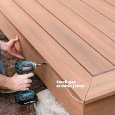 a man is using a drill to attach a decking board with two screwdrivers