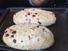 two loaves of bread sitting on top of a pan