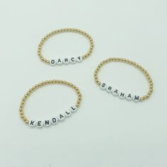 "Personalized 4mm gold filled beaded bracelet with name or word of your choice. Letter beads have a white background with black letters. Each bracelet can be personalized with a name or word of your choice along with your desired length. These bracelets are 14k gold filled and will not tarnish, and look great alone or in a stack! Bracelets come in an organza pouch and make perfect gifts. You will be able to enter custom name requests on the checkout page under \"add an optional note to seller.\" Hypoallergenic Round Beads Name Bracelet For Everyday, Customizable Name Bracelet With Round Beads For Everyday, Customized Name Bracelet With Round Beads For Everyday, Customizable Name Bracelet With Round Beads, Everyday Customized Name Bracelet With Round Beads, Minimalist Name Bracelet With Round Letter Beads, Everyday Custom Name Round Bead Bracelets, Customizable Dainty Beaded Bracelets For Personalized Gifts, Customizable Dainty Beaded Bracelets As Personalized Gift