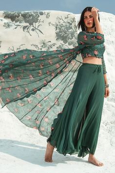 Green crop top with floral printed motifs. Comes with palazzo pant and long jacket.
Components:3
Neckline:Boat
Sleeve Length:Top: Sleeveless; Jacket: Three fourth
Fabric:Top: Cotton Silk; Palazzo: Georgette; Jacket: Organza
Color:Green
Scallop hem on crop top
Sequin motifs on crop top
Floral printed motifs on jacket
Scallop hem on jacket border and sleeves
Closure: Drawcord waist band tie-up on pant - Aza Fashions Palazzo With Top, Paulmi And Harsh, Trendy Outfits Indian, Indian Gowns Dresses, Kurti Designs Party Wear, Indian Gowns, Designer Party Wear Dresses, Dress Indian Style, Stylish Dresses For Girls