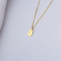 Stylish and minimalist 14K gold personalized tag necklace for everyday wear. Great for layering.  Unique personalized gift idea to show love to the important people in your life with a cute, dainty, and creative gift. The custom vertical bar name necklace makes a perfect birthday gift for mothers, friends or yourself.  A special anniversary gift for significant others. Just engrave his/her name. It is a perfect gift. It can be dressed up or dressed down depending on the situation. We only use th Minimalist Nameplate Charm Necklaces For Mother's Day, Everyday Gold Nameplate Charm Necklaces, Minimalist Nameplate Charm Necklace For Mother's Day, Everyday Gold Nameplate Charm Necklace, Minimalist Yellow Gold Charm Necklace For Birthday, Rectangular Tag Jewelry For Gifts, Minimalist Everyday Nameplate Charm Necklace, Minimalist Mother's Day Nameplate Charm Necklace, Minimalist Tarnish Resistant Nameplate Necklace