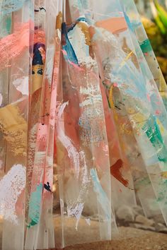 an umbrella is covered with plastic wrap and paint