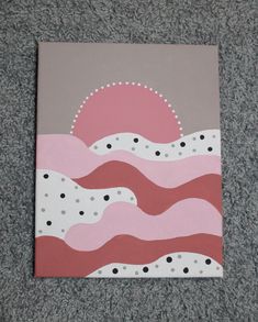 a painting on the ground that looks like waves with dots and circles in pink, grey and white