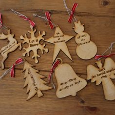 wooden christmas ornaments with red ribbon and snowflakes