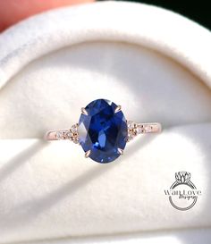 a close up of a ring with a blue stone