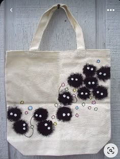 a white bag with black flowers on it