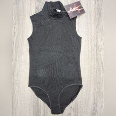 This Is All Black And Sleeveless W A Collar Neck. Snaps In Crotch. Pit To Pit Measurements Approx 14 1/2 Inches And Shoulders To Crotch Approx 25 1/2 Inches. Please See Pics For Care And Material Content. Summer Sleeveless Shaping Bodysuit, Sleeveless Stretch Bodysuit Shapewear, Stretch Sleeveless Shapewear Bodysuit, Fitted Sleeveless Shapewear Bodysuit, Black Sleeveless Shapewear Top, Black Shaping Sleeveless Tank Top, Black Shaping Tank Top, Seamless Shaping Sleeveless Bodysuit, Stretch Sleeveless Camisole Shapewear