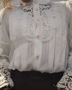 Step into timeless elegance with our Lace-Up Floral Blouse, a versatile piece that seamlessly blends vintage charm with modern flair. Crafted from delicate cotton lace, this blouse features intricate floral embroidery, exuding sophistication and grace. 🌸 Elevate Your Style 🌸 The lace-up top adds a touch of allure, while the floral embroidery enhances its feminine appeal. Whether you're attending a wedding or a work event, this blouse is sure to turn heads. 🌿 Features and Details 🌿 Fabric: So Elegant Embroidered Formal Tops, Elegant Formal Embroidered Top, Elegant White Blouse Piece With Intricate Embroidery, Elegant Fitted Lace Top With Floral Embroidery, White Floral Embroidery Blouse For Wedding, Elegant White Blouse With Floral Embroidery, White Floral Embroidered Blouse For Wedding, White Blouse With Floral Embroidery For Wedding, Elegant White Lace Work Tops