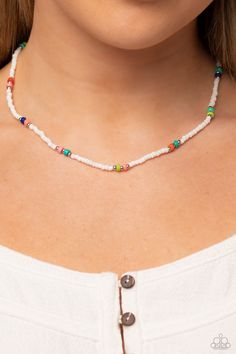 Infused on an invisible wire, white seed beads, silver studs, and circular multicolored stones coalesce around the collar for a puka-shell look-alike layer. Features an adjustable clasp closure. As the stone elements in this piece are natural, some color variation is normal. Sold as one individual necklace. Includes one pair of matching earrings. Summer Spacer Bead Choker Jewelry, Adjustable Round Beads Choker For Beach, Adjustable White Beaded Chain, Handmade White Heishi Beads Jewelry, Adjustable Single Strand White Jewelry, Adjustable Single Strand Jewelry For Vacation, White Adjustable Single Strand Jewelry, Adjustable White Single Strand Jewelry, Resizable White Jewelry For The Beach