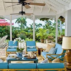 an outdoor living area with blue and yellow furniture