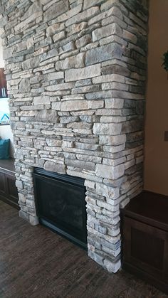 a large stone fireplace in a living room