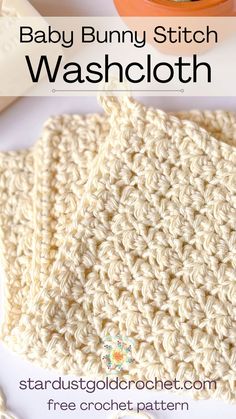 the baby bunny stitch washcloth is crocheted in white yarn and sits on a table