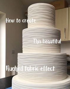 a large white cake sitting on top of a counter