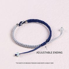 the adjustable bracelet is made with blue and white thread, which are attached to an adjustable clasp