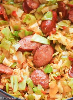 sausage and cabbage in a skillet ready to be cooked for the dinner guests at home